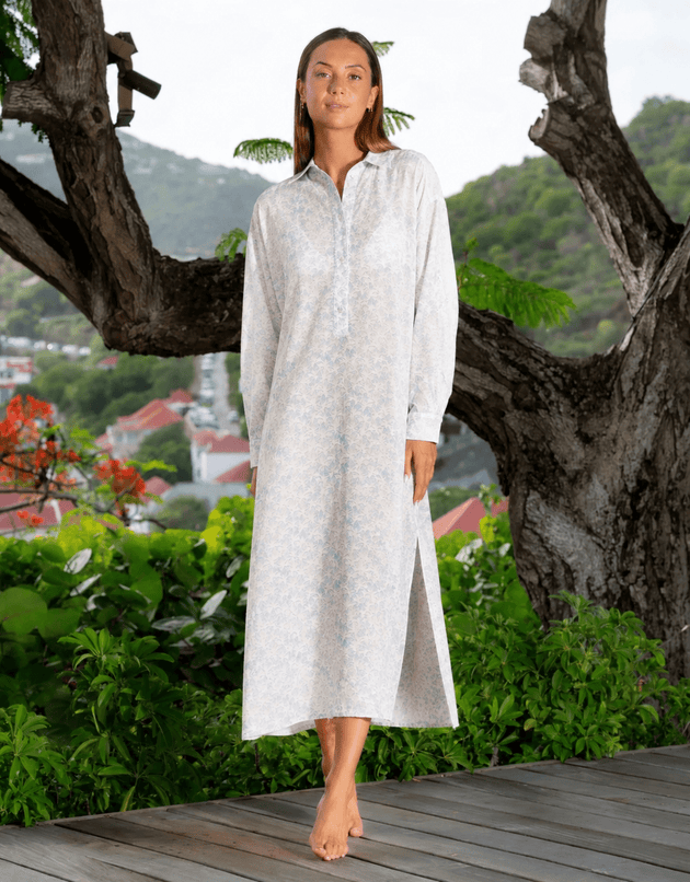 Woman in light blue Palms print Kate shirt dress